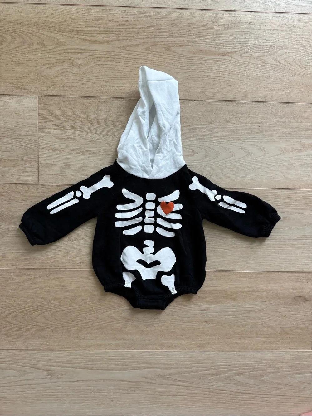 Old Navy Black and White Skeleton Hoodie Romper with Orange Heart